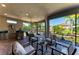Enclosed brick patio features an outdoor kitchen, dining area, and relaxing seating overlooking the pond at 4908 Tivoli Run, Bradenton, FL 34211