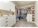 Walk-in closet with extensive storage solutions, featuring drawers, shelves and hanging rods at 4908 Tivoli Run, Bradenton, FL 34211