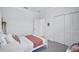 Clean bedroom with neutral colors, plenty of storage, and a serene atmosphere at 4975 Seafoam Trl, Bradenton, FL 34211