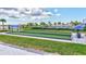 Bocce ball courts with covered seating areas for players or guests, with well-manicured landscaping and palm trees at 4975 Seafoam Trl, Bradenton, FL 34211