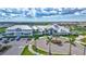 Community clubhouse with manicured landscaping, palm trees, and convenient parking for residents at 4975 Seafoam Trl, Bradenton, FL 34211