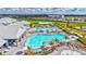 Community pool with plenty of seating, palm trees, and Gathering-friendly amenities at 4975 Seafoam Trl, Bradenton, FL 34211