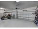 Spacious three-car garage with ample storage and parking for a golf cart at 4975 Seafoam Trl, Bradenton, FL 34211