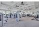 Bright community gym with various machines, ceiling fans and mirrors for a comprehensive work out experience at 4975 Seafoam Trl, Bradenton, FL 34211