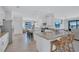 Bright kitchen featuring stainless steel appliances, granite countertops, and a center island with bar seating at 4975 Seafoam Trl, Bradenton, FL 34211
