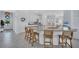 Bright kitchen featuring stainless steel appliances, granite countertops, and a center island with bar seating at 4975 Seafoam Trl, Bradenton, FL 34211