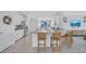 Bright kitchen featuring stainless steel appliances, granite countertops, and a center island with bar seating at 4975 Seafoam Trl, Bradenton, FL 34211