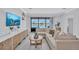 Cozy living space featuring a sectional sofa, entertainment center, and sliding glass doors overlooking the pool at 4975 Seafoam Trl, Bradenton, FL 34211