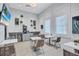 Beautifully furnished lounge with tables and chairs for residents to relax and enjoy each others company at 4975 Seafoam Trl, Bradenton, FL 34211