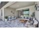 Inviting covered patio features comfortable seating, decor, and view of the sparkling water at 4975 Seafoam Trl, Bradenton, FL 34211
