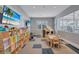 View of the playroom with a table, chairs and many toys to keep the entertained at 4975 Seafoam Trl, Bradenton, FL 34211