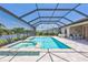 Enclosed pool area with spa, fountain, and outdoor seating offering serene water views at 4975 Seafoam Trl, Bradenton, FL 34211