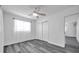 Clean and well-lit bedroom featuring wood-look floors and a large closet for ample storage at 5214 11Th S Ave, Gulfport, FL 33707
