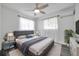 Bright bedroom featuring a comfortable bed, ceiling fan, and stylish decor with natural light at 5214 11Th S Ave, Gulfport, FL 33707