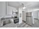 Modern kitchen featuring stainless steel appliances, granite countertops, and ample cabinet space at 5214 11Th S Ave, Gulfport, FL 33707