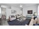 Bright and airy living room featuring modern furnishings, a plush rug, and stylish decor at 5214 11Th S Ave, Gulfport, FL 33707
