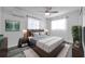 Comfortable bedroom with wood-look floors, soft lighting, and stylish decor, perfect for relaxation at 5214 11Th S Ave, Gulfport, FL 33707