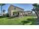 Spacious backyard featuring a covered patio and well-maintained landscaping, perfect for outdoor enjoyment at 5403 Mang Pl, Sarasota, FL 34238