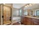Bathroom boasts a separate shower and tub with a double vanity and granite countertops at 5403 Mang Pl, Sarasota, FL 34238
