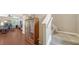 Entryway with hardwood floors, staircase, and a decorative cabinet at 5403 Mang Pl, Sarasota, FL 34238