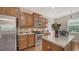 Bright kitchen features stainless steel appliances, granite countertops, and a center island at 5403 Mang Pl, Sarasota, FL 34238