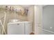 Laundry area with washer, dryer, shelving for storage, and convenient access at 5403 Mang Pl, Sarasota, FL 34238