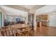 Open-concept living room and kitchen with hardwood floors at 5403 Mang Pl, Sarasota, FL 34238