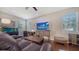 Cozy living room featuring hardwood floors, natural light, and comfortable seating at 5403 Mang Pl, Sarasota, FL 34238
