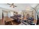 Open-concept living room and dining area with hardwood floors and comfortable seating at 5403 Mang Pl, Sarasota, FL 34238