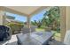 Outdoor patio with views of the lush backyard at 5403 Mang Pl, Sarasota, FL 34238