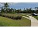 Landscaped community space with walking path at 5430 Amaryllis Garden St, Apollo Beach, FL 33572