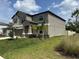 Attractive two-story home with neat landscaping and a well-maintained front yard at 5430 Amaryllis Garden St, Apollo Beach, FL 33572
