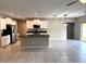 Bright kitchen featuring stainless steel appliances, a center island, and ample counter space at 5430 Amaryllis Garden St, Apollo Beach, FL 33572
