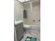 Bathroom featuring shower-tub combination, gray vanity and modern flooring at 5625 15Th Ave W, Bradenton, FL 34209