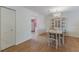 Bright dining area featuring laminated flooring, a chandelier, a dining table, and chairs at 5625 15Th Ave W, Bradenton, FL 34209