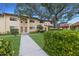 Inviting exterior with lush landscaping and a charming walkway leading to the entrance of the home at 5625 15Th Ave W, Bradenton, FL 34209