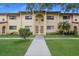 Charming exterior view of this two-story home with well-maintained lawn and inviting curb appeal at 5625 15Th Ave W, Bradenton, FL 34209