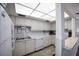 Bright and spacious kitchen with white cabinets, modern appliances, and ample counter space at 5625 15Th Ave W, Bradenton, FL 34209