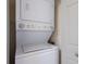 Efficient laundry setup with a stacked washer and dryer unit at 5625 15Th Ave W, Bradenton, FL 34209