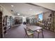 Well-stocked library with extensive bookshelves and comfortable seating, creating a quiet reading space at 5625 15Th Ave W, Bradenton, FL 34209