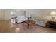Open-concept living and dining area with laminate flooring and views of the kitchen at 5625 15Th Ave W, Bradenton, FL 34209