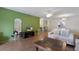Well-lit living area and dining room combination with laminate floors and a view to the kitchen at 5625 15Th Ave W, Bradenton, FL 34209