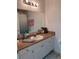 Bathroom with large mirror, vanity, and ample countertop space at 5741 Soldier Cir # 202, Sarasota, FL 34233