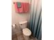 Cozy bathroom with a clean white toilet and a decorative shower curtain at 5741 Soldier Cir # 202, Sarasota, FL 34233
