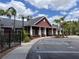 Inviting clubhouse exterior with well-maintained landscaping and convenient parking at 5741 Soldier Cir # 202, Sarasota, FL 34233