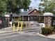 Community entrance gate with stone pillars and landscaping, ensuring security and curb appeal at 5741 Soldier Cir # 202, Sarasota, FL 34233