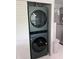 Modern stacked LG washer and dryer in a closet offer convenience and space-saving design at 5741 Soldier Cir # 202, Sarasota, FL 34233