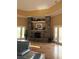 Comfortable lounge area with stone fireplace and access to outdoor space at 5741 Soldier Cir # 202, Sarasota, FL 34233