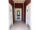 Community restrooms featuring white doors and tile floors for convenience and accessibility at 5741 Soldier Cir # 202, Sarasota, FL 34233