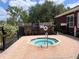 Community spa with brick surround, metal safety rails, and visible spa rules signage at 5741 Soldier Cir # 202, Sarasota, FL 34233